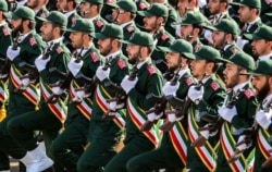 IRAN -- In this file photo taken on September 22, 2018 shows members of Iran's Revolutionary Guards Corps (IRGC) marching during the annual military parade which marking the anniversary of the outbreak of the devastating 1980-1988 war with Iraq