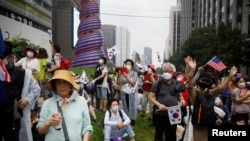 Members of conservative civic groups take part in an anti-government protest, as concerns over a fresh wave of the coronavirus disease (COVID-19) cases grow, in central Seoul, South Korea, August 15, 2020.