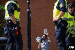 Salwan Momika protests outside a mosque in Stockholm on June 28, 2023, during the Eid al-Adha holiday. (Jonathan Nackstrand/AFP)