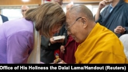 Tibetan spiritual leader, the Dalai Lama exchanges greetings with former U.S. House Speaker Nancy Pelosi during their meeting at Dharamshala, India, on June 19, 2024. (Office of His Holiness the Dalai Lama/via Reuters)