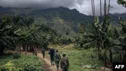 Congolese soldiers patrol the village of Mwenda, recently attacked by the armed group Allied Democratic Forces (ADF), in Rwenzori Sector, northeastern Democratic Republic of Congo, on May 23, 2021.
(ALEXIS HUGUET / AFP)