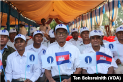 Korng Det, first left, sits along with other activists and supporters of the Candlelight Party at the party's Extraordinary Congress in Siem Reap province, Feb. 11, 2023. (Ten Soksreinith/VOA Khmer)