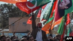 Supporters of Pakistan Tehreek-e-Insaf (PTI) and other parties protest against the alleged rigging of Pakistan's national election outside the office of a Returning Officer in Quetta on February 9, 2024, (Banaras Khan/AFP)