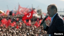 Turkish President Tayyip Erdogan addresses his supporters during a rally ahead of the May 14 presidential and parliamentary elections, in Izmir on April 29, 2023. (Turkish Presidential Press Office/ via Reuters) 
