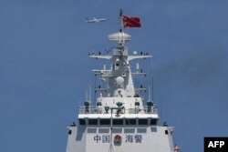 A US Navy's P-8 Poseidon patrol plane circling past a Chinese coast guard ship during the re-supply mission by a civilian boat chartered by the Philippine navy to deliver supplies to Philippine navy ship BRP Sierra Madre in the disputed South China Sea. (Aug 22, 2023)