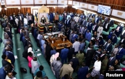 Ugandan lawmakers stand as they pass the anti-Homosexuality Bill at a session inside the Parliament building in Kampala, Uganda May 2, 2023. (REUTERS/Abubaker Lubowa)