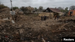 Police are seen at the site of a residential area hit by a Russian military strike in the town of Pavlohrad, in Ukraine's Dnipropetrovsk region, May 1, 2023. (Sofiia Gatilova/REUTERS)