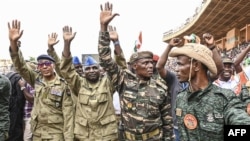 Nigerien military leaders wave to supporters at the General Seyni Kountche Stadium in Niamey, Niger, on Aug. 26, 2023. (Photo by AFP)
