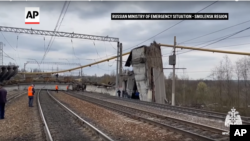 The aftermatch of a bridge collapse that killed one and injured five in Vyazma, a city in Smolensk region, Russia, on April 8, 2024. (Russian Ministry of Emergency Situations/via AP)