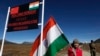 An Indian girl stands with an Indian flag at the India-China border in Bumla, Arunachal Pradesh, on October 21, 2012. India is protesting a new Chinese map that lays claim to India’s territory ahead of next week's Group of 20 summit in New Delhi. (Anupam Nath/AP)