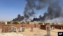 Smoke fills the sky in Khartoum near Doha International Hospital on April 21, 2023. (Maheen S/via AP)