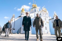 President Joe Biden walks with Ukrainian President Volodymyr Zelenskyy at St. Michael's Golden-Domed Cathedral on a surprise visit to Kyiv on February 20, 2023. (Evan Vucci/AP)