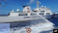 A Chinese coast guard ship uses water canons on a Philippine Coast Guard ship near the Philippine-occupied Second Thomas Shoal on August 5, 2023. (Philippine Coast Guard via AP)