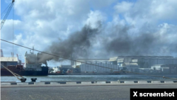 Screen capture of a picture shared by X user Iran Spectator showing the Turkish-owned cargo ship Yaf Horizon, which caught fire while docked at the Port of Haifa, in Israel, on June 10, 2024. 