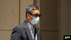 Jason Zhu returns to Brooklyn Federal Court for a trial on "Operation Fox Hunt" in New York on May 31, 2023. (AFP/Yuki IWAMURA )