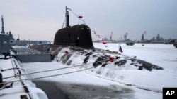 The newly built nuclear submarine The Krasnoyarsk is seen after a flag-raising ceremony on Monday for newly built nuclear submarines at the Sevmash shipyard in Severodvinsk in Russia's Archangelsk region, Dec. 11, 2023. (Kirill Iodas, Kremlin Pool Photo via AP)