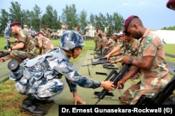A photograph of Chinese Marines training South African troops on an unspecified date posted to the Website of Air University, Maxwell Air Force Base. (Dr. Ernest Gunasekara-Rockwell).