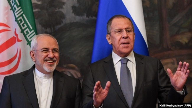 RUSSIA -- Russian Foreign Minister Sergei Lavrov (R) gestures next to his Iranian counterpart Mohammad Javad Zarif during a family photo ahead of a meeting of foreign ministers of the Caspian Sea littoral states in Moscow, December 05, 2017