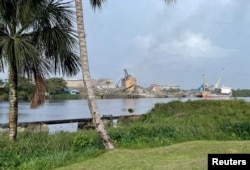 A ship docks in Linden, Guyana, July 17, 2022. (Gram Slattery/Reuters)