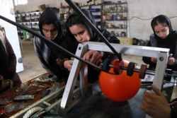 AFGHANISTAN -- Afghan all-girl robotics team work on their new robotic project at their lab in Herat, February 20, 2019.