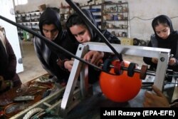 AFGHANISTAN -- Afghan all-girl robotics team work on their new robotic project at their lab in Herat, February 20, 2019.