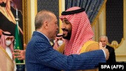 On April 28, 2022, Turkish President Tayyip Erdogan (L) embraces Saudi Crown Prince Mohammed bin Salman during a meeting in Saudi Arabia's Red Sea coastal city of Jeddah. (Saudi Press Office/AFP)
