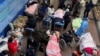 Patients lie on beds and stretchers in a hallway in the emergency department of a hospital, amid the coronavirus disease (COVID-19) outbreak in Shanghai, China, Jan. 4, 2023.