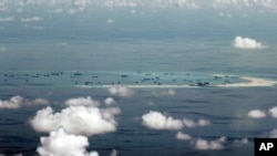 Land reclamation of Mischief Reef in the Spratly Islands by China in the South China Sea on May 11, 2015. (Ritchie B. Tongo/AP)