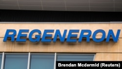 FILE PHOTO: The Regeneron Pharmaceuticals company logo is seen on a building at the company's Westchester campus in Tarrytown, New York, U.S. September 17, 2020.