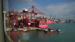 A view from a tram window shows shipping containers at a port in Hong Kong, November 5, 2021. (AP/Kin Cheung)