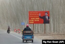 Chinese President Xi Jinping on a billboard, March 21, 2021. (Ng Han Guan/Associated Press)