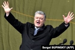 UKRAINE – Ukrainian President Petro Poroshenko greets his supporters during a campaign rally in Kyiv on March 17, 2019