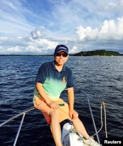 Chinese-American citizen Kai Li, who has been detained in China since 2016, poses for a picture while fishing on the Long Island Sound in New York, U.S., August 23, 2015, in this handout picture.