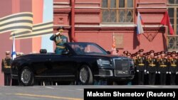 RUSSIA -- Chief of the Russian Land Forces Oleg Salyukov drives an Aurus cabriolet during a rehearsal for the Victory Day parade, which marks the anniversary of the victory over Nazi Germany in World War Two, on Red Square in central Moscow, May 7, 2019