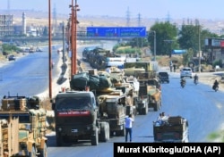 SYRIA -- A Turkey Armed Forces convoy is seen at a highway between Maaret al-Numan and Khan Sheikhoun in Idlib province, August 19, 2019