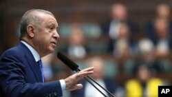 Turkish President Recep Tayyip Erdogan addresses his ruling party legislators in Ankara, Wednesday, May 18, 2022. (AP)