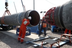 Workers are seen at the construction site of the Nord Stream 2 gas pipeline, near the town of Kingisepp, Leningrad region, Russia, June 5, 2019. (Anton Vaganov/Reuters)