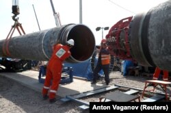 Workers are seen at the construction site of the Nord Stream 2 gas pipeline, near the town of Kingisepp, Leningrad region, Russia, June 5, 2019. (Anton Vaganov/Reuters)