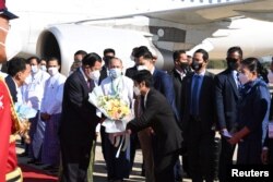 Cambodian Prime Minister Hun Sen is welcomed as he visits Naypyitaw, on January 7, 2022. (Cambodian Government/via Reuters)