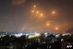 Israel's Iron Dome air defense system intercepts rockets launched from Gaza on October 11, 2023. (Mahmud Hams/AFP)