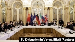 Deputy Secretary General of the European External Action Service (EEAS) Enrique Mora and Iran's chief nuclear negotiator Ali Bagheri Kani and delegations wait for the start of a meeting of the JCPOA Joint Commission in Vienna, Austria December 17,2021. (Reuters)
