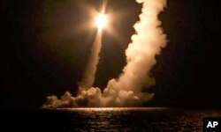 Intercontinental ballistic missiles are launched by the Vladimir Monomakh nuclear submarine of the Russian Navy from the Sera of Okhotsk on December 12, 2020. (Russian Defense Ministry Press Service/ via AP)