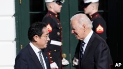 President Joe Biden greets Japanese Prime Minister Fumio Kishida on the South Lawn of the White House in Washington, D.C., on January 13, 2023. (Susan Walsh/AP)