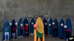 An Afghan women's soccer team poses for a photo in Kabul, Thursday, Sept. 22, 2022. The ruling Taliban have banned women from sports as well as barring them from most schooling and many realms of work. (AP Photo/Ebrahim Noroozi)