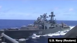 AT SEA --A screen grab from video shows the Russian naval destroyer Admiral Vinogradov making what the U.S. Navy describes as an unsafe maneuver against the Ticonderoga-class guided-missile cruiser USS Chancellorsville in the Philippine Sea, June 7, 2019