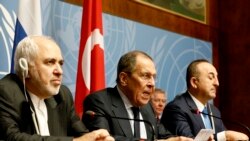 Iranian Foreign Minister Mohammad Javad Zarif, Russian Foreign Minister Sergei Lavrov and Turkish Foreign Minister Mevlut Cavusoglu attend a press conference on a meeting of the Syria constitution-writing committee, in Geneva, October 29, 2020.