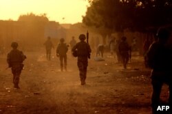 French soldiers patrol the streets of Gao, Mali on December 4, 2021. (Thomas Coex/ AFP)