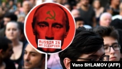 GEORGIA – Participants attend an anti-Russian rally in front of the parliament building in Tbilisi on June 22, 2019