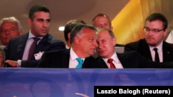 HUNGARY -- Russian President Vladimir Putin and Hungarian Prime Minister Viktor Orban talk as they attend the Suzuki World Judo Championship in Budapest, Hungary, August 28, 2017
