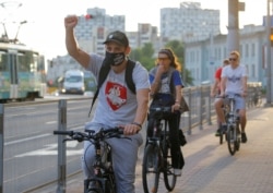 Minsk, Belarus - Participants ride bicycles during a protest flash mob.